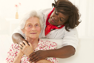 caregiver hugged a senior woman