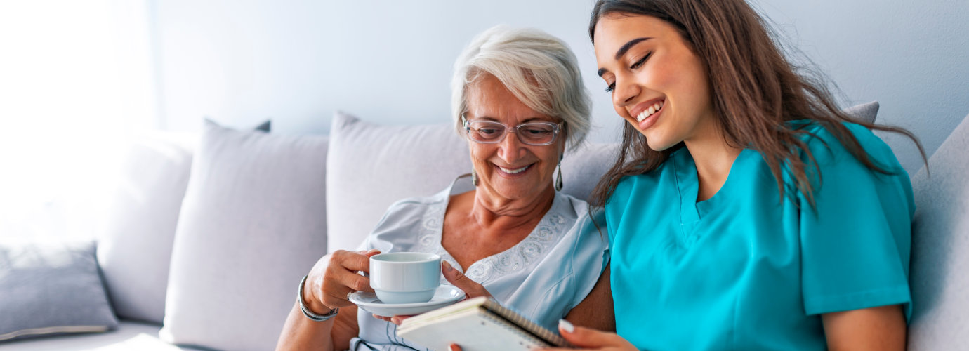 caregiver and elderly reading