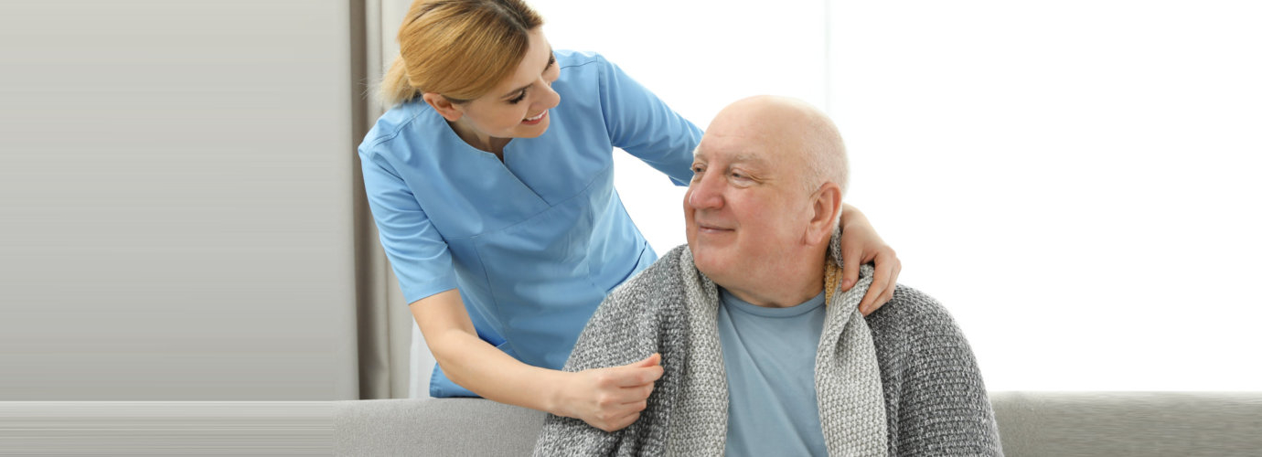 senior man being served by a caregiver